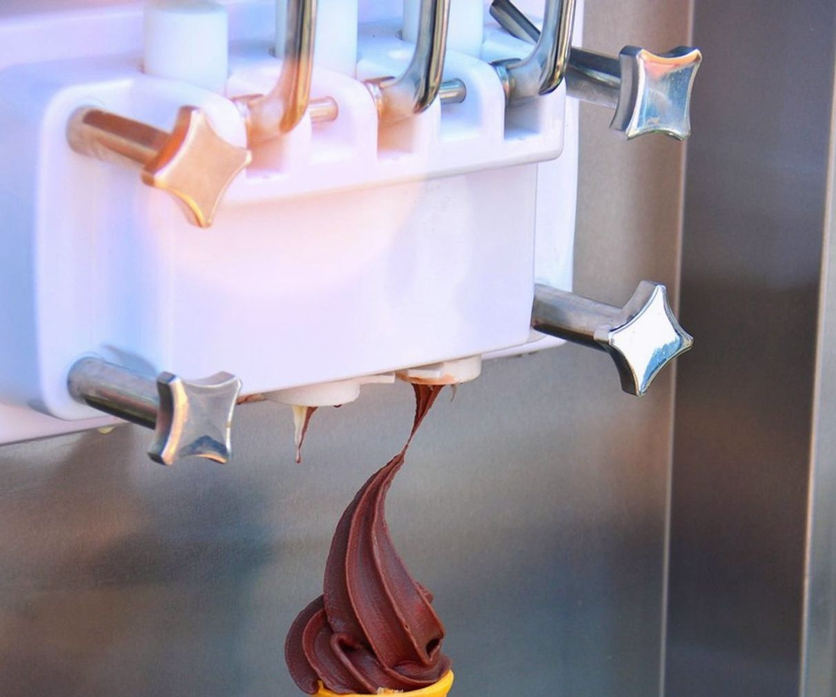 Display case filled with colorful gelato and ice cream flavors